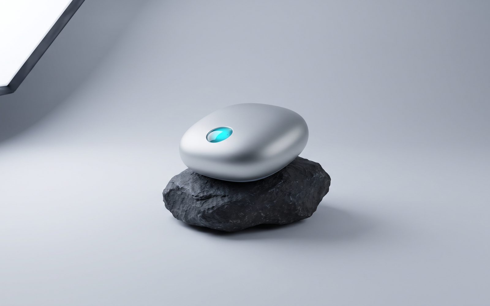 Pebble shaped smart speaker on dark stone